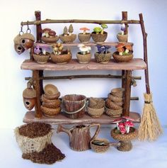 a wooden shelf filled with baskets and stuffed animals on top of it's sides