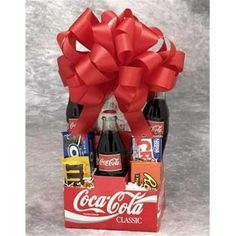 Nostalgia runs wild in the Coke Pack gift basket. The snacks America has loved for generations will take your special someone back to a simpler place and time. Classic Coke, childhood chocolate favorites, popcorn and Wrigley's gum will make you feel like a kid again. Make the day special with the Coke Pack gift basket. The Old Time Coke Gift Pack.Old Time Coke Pack - Small. Includes: 3 Classic Cokes Peanut M& M's Reese's Peanut Butter Cups Oreo Cookies Nestle Crunch Ba Cracker Jacks Microwave Popcorn Luden's Cherry Throat & Cough Drops Wrigley's GumSpecifications Size: Small Weight: 4 lbs - SKU: GFT338 Color: Multicolor. Coca Cola Gifts, Coke Gifts, Snack Gift Baskets, Nestle Crunch, Reese's Peanut Butter Cups, Snack Gift, Teenager Gifts, Creative Diy Gifts, Aromatherapy Gifts