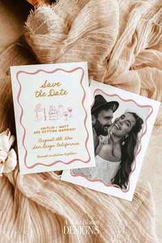 save the date cards on top of a blanket