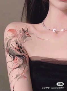 a woman with a tattoo on her arm