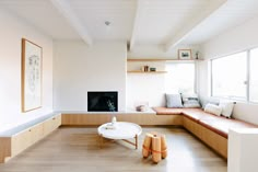 a living room filled with furniture and a fire place