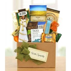 a box filled with lots of different types of food and snacks on top of a table