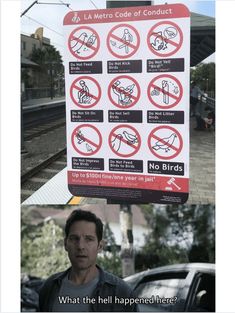 a man is standing in front of a sign