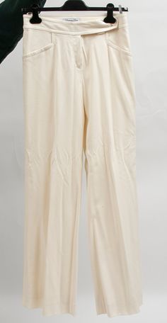 Christian Dior designer clothing women's dress pants. Size 6. At the time of this listing, matching Christian Dior pieces are available (jacket, skirt, two pairs of pants). Elegant Cream Pants For Formal Occasions, Elegant Cream Formal Pants, Classic Cream Dress Pants For Formal Occasion, Cream Evening Trousers, Elegant Beige Silk Pants, Tailored Cream Pants For Formal Occasions, Elegant Stretch Cream Pants, Classic Fitted Off White Bottoms, Elegant Cream Pants For Evening