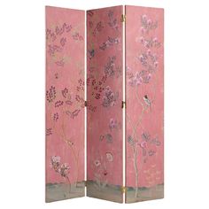 a pink room divider with flowers painted on it