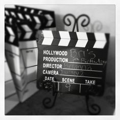 a black and white photo of a movie clapper