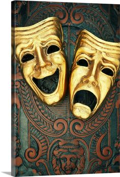 two golden masks with mouths open and eyes closed