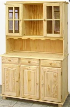 a wooden hutch with glass doors and drawers