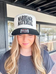 Make a statement with our Marriage Material Trucker Hat. Perfect for the newly engaged or for a playful gift, this hat is made for those who are ready to tie the knot (or just want to pretend until then). With its trendy trucker style, it's the perfect blend of fun and fashion! Marriage Material Hat, Novelty Baseball Cap With Flat Bill And Adjustable Fit, Novelty Adjustable Flat Bill Baseball Cap, Adjustable Trucker Style Mini Cap, Adjustable Trucker Mini Cap, Novelty Adjustable Flat Bill Hat, Wedding Snapback Trucker Hat, Novelty Adjustable Trucker Hat With Flat Bill, Adjustable Trucker Hat For Wedding