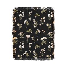 a black square scarf with flowers and fringes