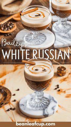 two glasses filled with white russian coffee on top of a wooden table