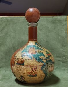 a bottle with a map on it sitting on a table