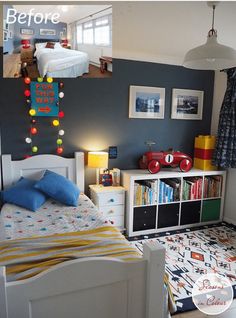 a child's bedroom with blue walls and white bedding, bookshelves and toy cars