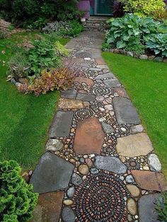 a stone path in front of a house