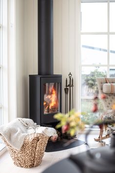 a living room filled with furniture and a fire place