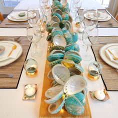 a long table with plates and silverware on it