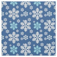 a blue and white snowflake pattern on fabric