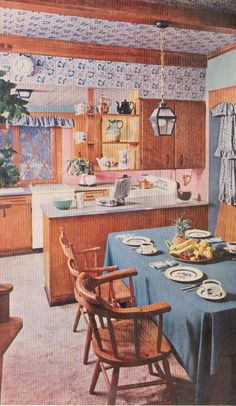 an old photo of a kitchen and dining room