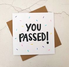 a card that says you passed with sprinkles on it