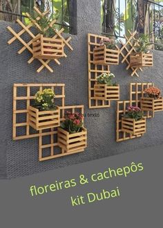 several wooden planters mounted to the side of a building