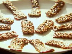 several cookies are arranged on a white plate