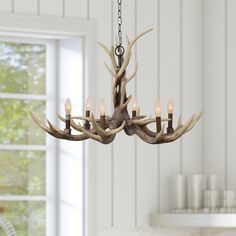 This beautiful antler style chandelier from the Fallow Ridge collection is a great way to bring rustic charm and a feeling of the great outdoors into your home! allen + roth Fallow Ridge 6 -Light Bronze Rustic For Use in Bedrooms, Dining Rooms, Foyers, Living Rooms Chandelier | CH20-6BZA Northwoods Decor, Star Chandelier, Chandelier Chain, Vanity Light Bar, Bar Chandelier, Kitchen Island Chandelier, Cabin Lighting, Silver Chandelier, Allen Roth