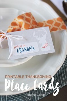 a white plate topped with an orange and white place card