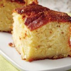 two pieces of cake sitting on top of a white plate