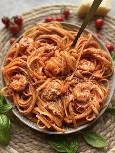 pasta with shrimp and tomato sauce in a bowl