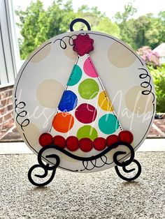 a paper plate with a birthday hat on it