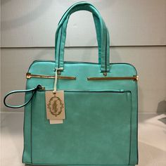 Perfect Spring Handbag In A Gorgeous Eye Catching Turquoise Color. This Bag Is A Generous 17” Tall From Handle To Base, 12.5” Long And 5” Wide. It Has Two Loop Handles As Well As The Detachable Over The Shoulder Handle. For Compartments, This Bag Has Them In Spades! Front And Back Zipper Compartments, Top Zipper, Middle Zip Compartment, Inside Small Zip Pocket And One Open Pocket. Please Note: There Is Some Mottling In The Leather Color On The Back That Was There When I Purchased This Bag. There Turquoise Bag With Detachable Strap For Everyday Use, Turquoise Bags With Detachable Strap For Daily Use, Turquoise Satchel Shoulder Bag For Everyday, Turquoise Shoulder Bag With Detachable Strap For Everyday, Turquoise Rectangular Shoulder Bag For Everyday, Turquoise Everyday Crossbody Bag, Chic Turquoise Rectangular Shoulder Bag, Trendy Turquoise Tote Bag, Daily Use Turquoise Bags With Detachable Strap