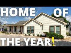 a house with the words home of the year in front of it