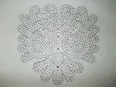 a drawing of an intricate design on a white wall