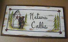 a sign that says nativity calls with a bear in a birdcage