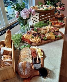 an assortment of breads and pastries on a table