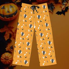 Unwind in style with these playful Men's Halloween-Themed Pajama Pants featuring a fun all-over print of ghosts, mushrooms, candles, candy, and coffins. Perfect for lounging or sleeping, these pajama pants are made from 100% polyester jersey knit fabric, offering a silky-smooth feel and lightweight comfort. The relaxed fit, paired with a back elastic waistband and adjustable black drawstring, ensures the perfect fit for ultimate ease. Whether you're getting cozy at home or drifting into dreamland, these spooky yet charming pajama pants are the perfect choice for adding a touch of Halloween spirit to your relaxation routine.  - 100% polyester for a soft, breathable feel - Lightweight fabric (6 oz/yd²) designed for comfort - Relaxed fit for unrestricted movement - Adjustable waistband with b Cozy Sleepwear, Sleep Shorts, Pajama Robe, Getting Cozy, Jersey Knit Fabric, Spirit Halloween, Nightwear, Halloween Themes, Festival Season