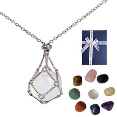 a necklace with various stones and a gift box