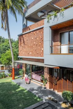 an apartment building with wooden balconies and palm trees