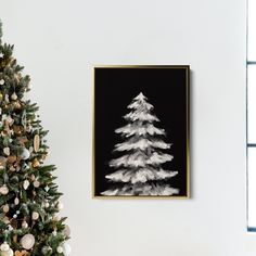 a black and white christmas tree in a living room