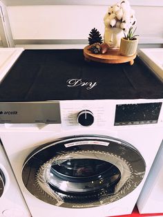 a washing machine sitting on top of a counter