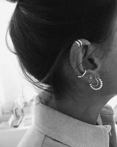 black and white photograph of woman with ear piercings