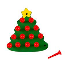 a plastic christmas tree with red balls and a yellow star on top, next to a toy screwdriver