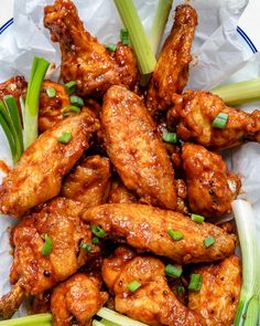 chicken wings with celery and onions in a bowl