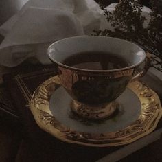 a tea cup sitting on top of a saucer