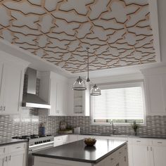 a large kitchen with white cabinets and black counter tops, an island in the middle