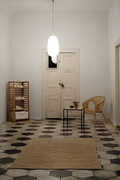 a room with a checkered floor and white walls