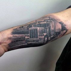 a man with a truck tattoo on his arm