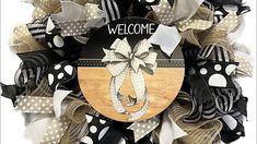 a welcome wreath with polka dots and ribbons