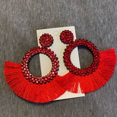 Bedazzled With Red Gems And Added Tassles Red Fringe Summer Jewelry, Red Fringe Jewelry For Summer, Trendy Red Tassel Earrings, Red Fringe Tassel Earrings For Summer, Red Earrings For Summer Party, Red Dangle Tassel Earrings With Fringe, Elegant Red Tassel Earrings With Fringe, Elegant Red Tassel Earrings For Summer, Red Tassel Jewelry For Summer