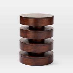 three tiered wooden side table with circular wood top and metal base, on white background